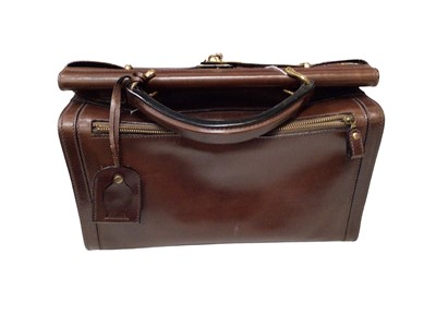 Lot 2050 - Vintage Etienne Aigner dark brown leather Gladstone bag with lock and key plus dust bag.