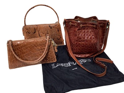 Lot 2052 - Leonard Paris good quality crocodile skin drawstring bucket hand bag with dust bag, plus a vintage python skin handbag and vintage crocodile skin handbag.