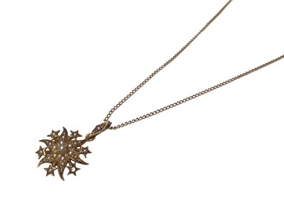 Lot 167 - Victorian 15ct gold and seed pearl star shaped pendant on a gold chain