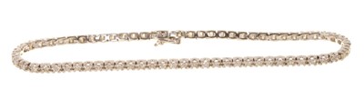 Lot 527 - Diamond tennis bracelet with a line of brilliant cut diamonds in 18ct white gold setting