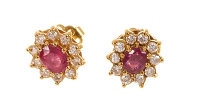 Lot 530 - Pair of Ruby and diamond cluster earrings