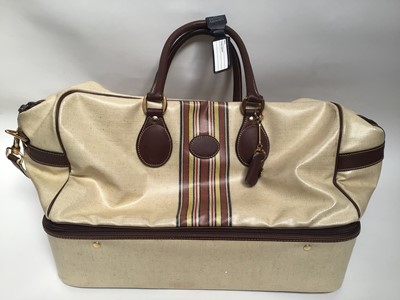 Lot 2056 - Vintage luggage - two striped weekend bags with leather trims and handles.