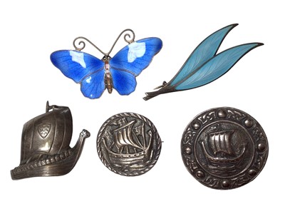 Lot 95 - Norwegian sterling silver and enamel butterfly and double leaf brooch, Danish silver Viking ship brooch and two other similar silver brooches (5)