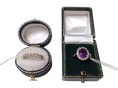 Lot 105 - 18ct gold diamond seven stone half eternity ring and 18ct gold amethyst and diamond cluster ring, both size M (2)