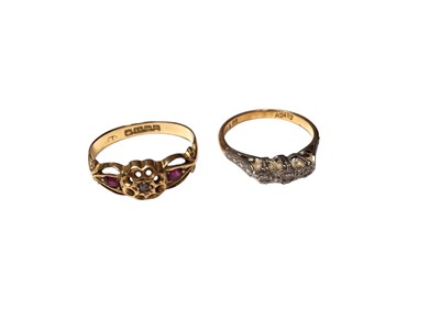 Lot 106 - Antique 18ct gold diamond and ruby ring in a pierced flower head setting, size L½ and 18ct gold diamond three stone ring in a platinum illusion setting, size J½ (2)