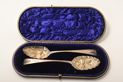 Lot 391 - Pair of Georgian silver berry spoons in a fitted case