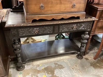 Lot 1281 - Late Victorian carved oak hall table with two drawers