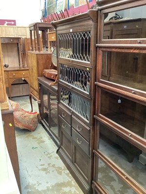 Lot 1210 - 1920s Barrister bookcase with three leaded glazed doors and four drawers and cupboards below