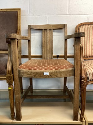 Lot 1385 - Oak elbow chair and a tub chair (2)