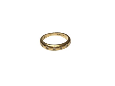 Lot 226 - 18ct gold ring with a diamond set band (London 1994), size I½