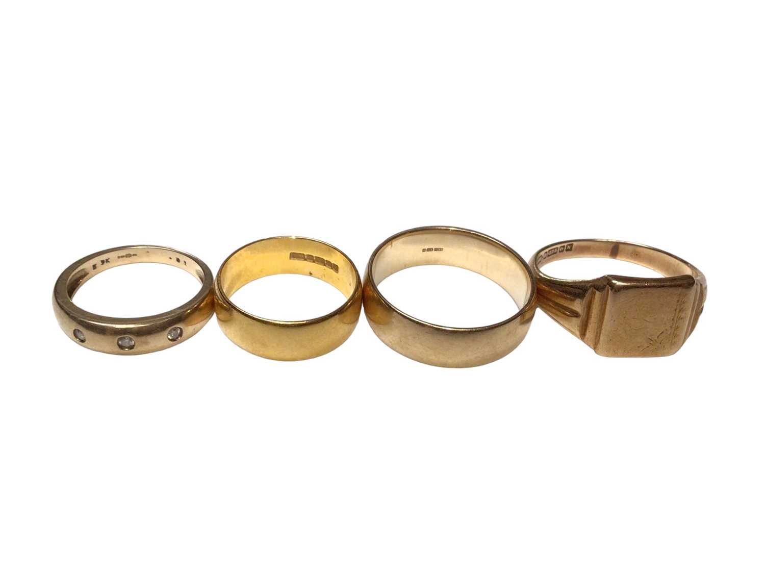 Lot 228 - 22ct gold wedding ring, 9ct gold wedding ring, 9ct gold diamond set band and 9ct gold signet ring (4)