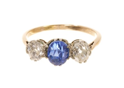 Lot 543 - Diamond and sapphire three stone ring