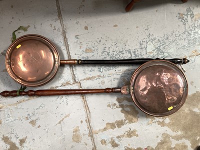 Lot 678 - Two 19th century copper warming pans with turned wooden handles