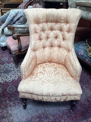 Lot 1291 - Late Victorian easy chair with buttoned peach upholstery, on turned legs and castors