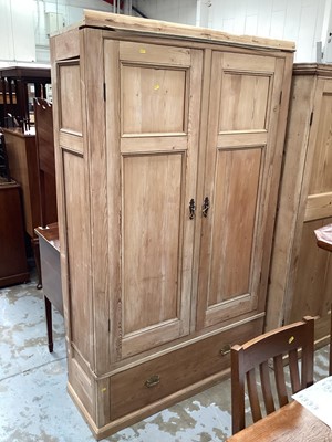 Lot 1232 - Antique pine wardrobe enclosed by two panelled doors and drawer below.