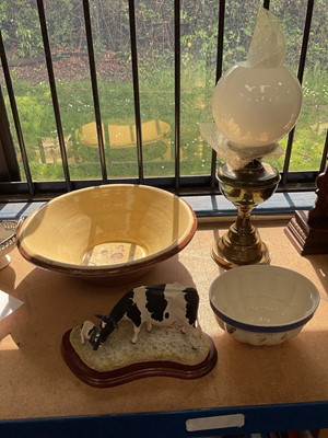 Lot 83 - Antique dairy bowl, Border Fine Arts cow and calf, oil lamp and a Wedgwood jelly mould (4)