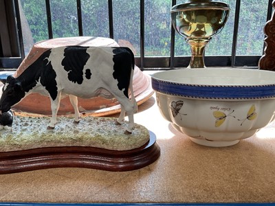 Lot 83 - Antique dairy bowl, Border Fine Arts cow and calf, oil lamp and a Wedgwood jelly mould (4)