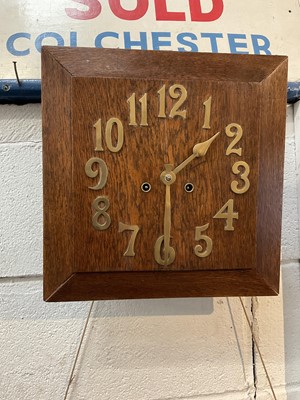 Lot 263 - Art Deco oak wall clock with applied brass numerals, in working condition (with key and pendulum)