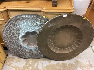 Lot 1373 - Two Middle Eastern brass top tables, on collapsible wooden stands