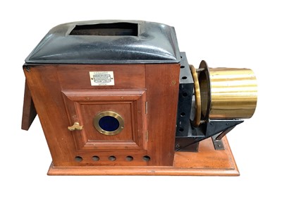 Lot 2497 - Victorian magic lantern in case, together with two boxes of glass slides