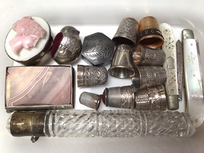 Lot 113 - Group of mostly silver thimbles, miniature silver bird pin cushion, two silver and mother of pearl fruit knives, silver cameo pill box, one other silver hexagonal pill box, banded agate book shaped...