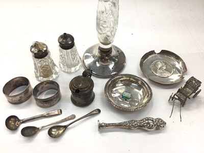 Lot 1010 - Two silver pin dishes, silver mustard pot, three silver salt spoons, silver handled seal, pair of silver (830) napkin rings and a white metal filigree carriage, silver mounted glass salts and vase