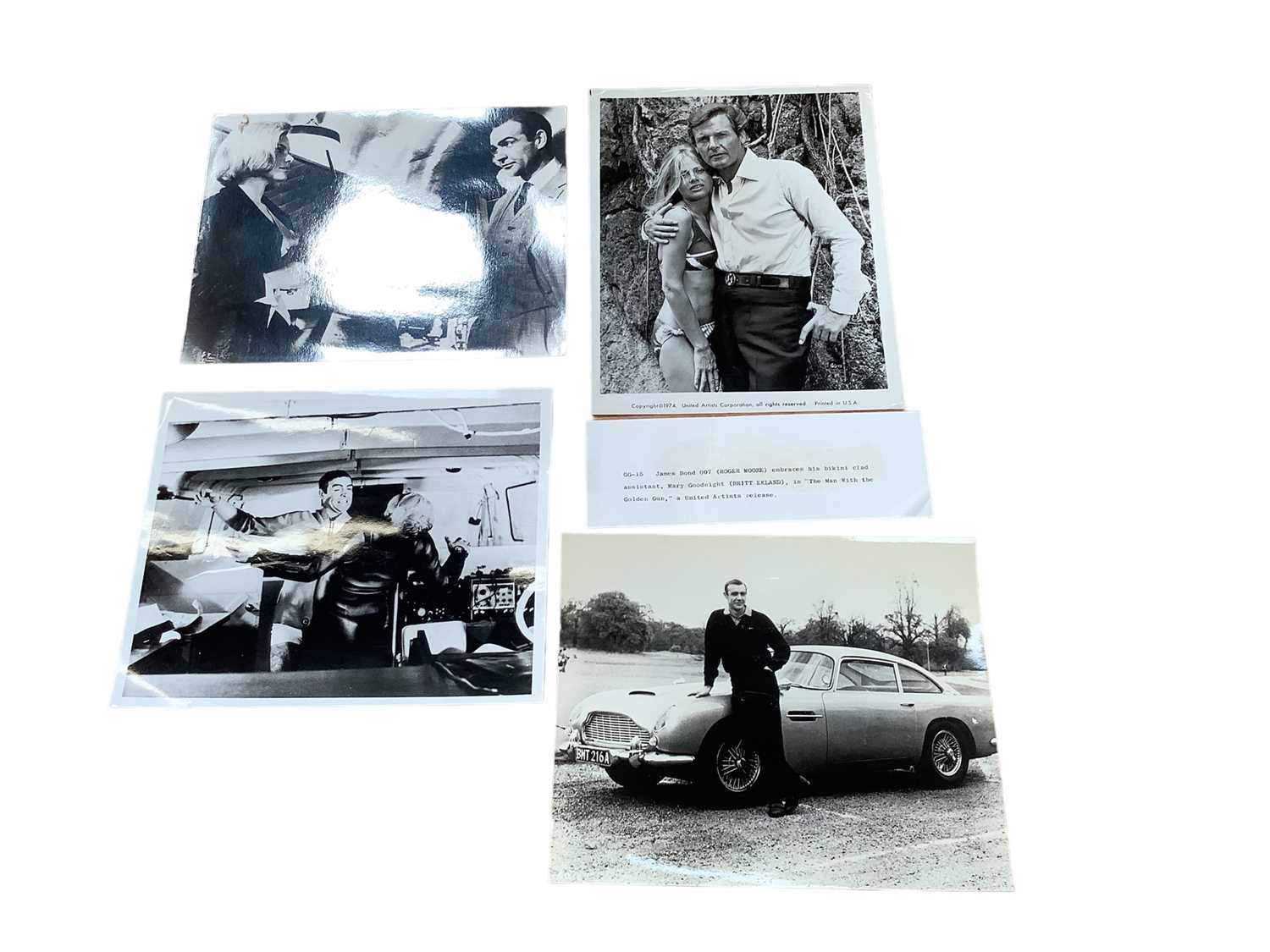 Lot 1407 - Group of James Bond lobby cards and promo photos, including Sean Connery,  Roger Moore, Timothy Dalton and George Lazenby