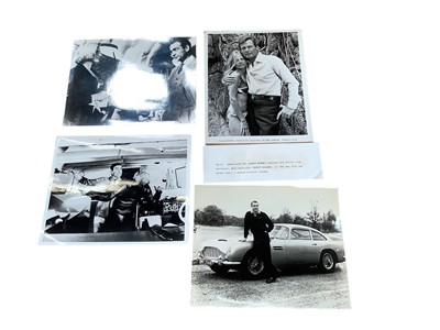 Lot 1407 - Group of James Bond lobby cards and promo photos, including Sean Connery,  Roger Moore, Timothy Dalton and George Lazenby