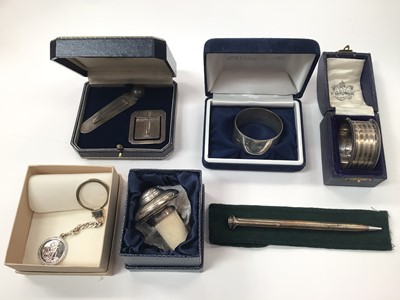 Lot 1019 - Group of silver to include two napkin rings, two bookmarks, bottle stopper, St. Christopher key ring and a Gucci (925) ballpoint pen