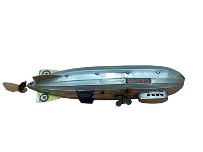 Lot 1918 - Box of tin plate including Tri Ang Minic Ambulance, British Rail Lorry, Wells Brimtoy bus, Japanese car, Areoplane, airship.