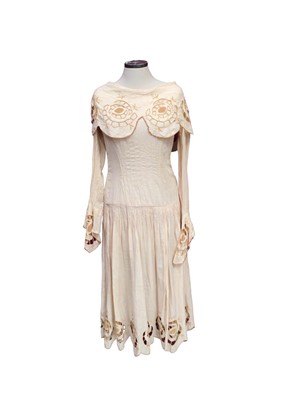 Lot 2102 - 1920's day dress cream cotton with embroidered cut-out work, scallop neckline, pin tuck front and ruched dropped waistline.