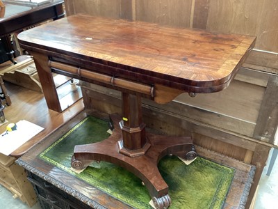 Lot 1259 - 19th century mahogany card table with foldover revolving top on faceted column on quatrefoil base with four scroll feet, 91.5cm wide