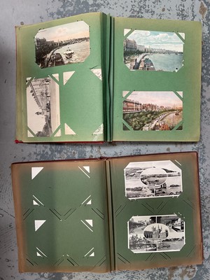 Lot 108 - Two albums of topographical postcards