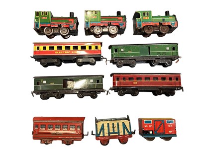 Lot 1768 - Tin plate collection of model railway, possibly Wells Brimtoy, to include locomotives, carriages, wagons and track.