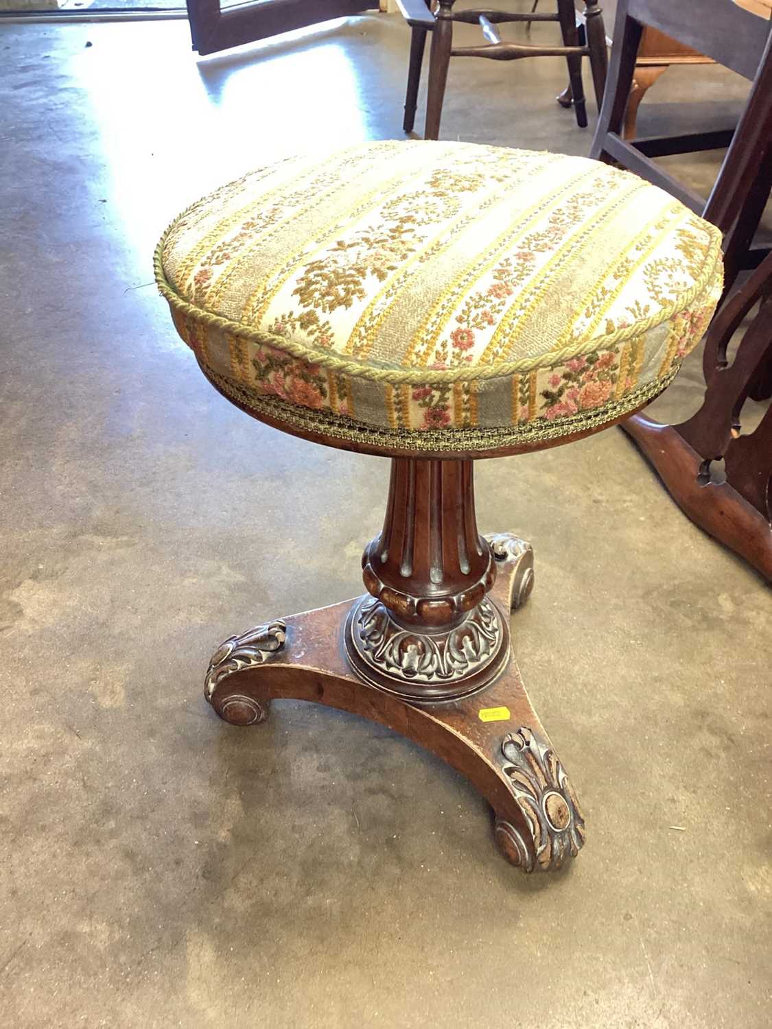 Lot 1285 - Victorian piano stool with floral embroidered seat on fluted turned column and trefoil base with scroll feet