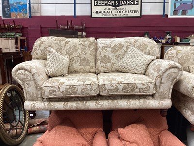 Lot 1289 - Good quality contemporary three piece suite with floral cream upholstery, comprising pair of two seater sofas and a matching armchair, together with a similar footstool (4)