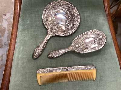 Lot 697 - Silver plated three piece dressing table set, plated tea ware, firkin & cast iron lion door stop