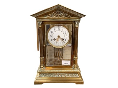 Lot 2479 - Edwardian French brass mantle clock in temple-shaped case