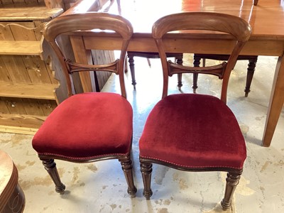 Lot 1309 - Set of four Victorian mahogany balloon back dining chairs with red upholstered seats on fluted turned front legs