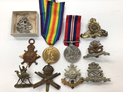 Lot 319 - First and Second World War medals, together with various military badges