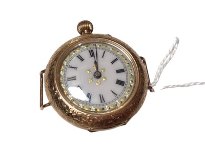 Lot 181 - 14ct gold cased fob watch in a floral scroll engraved case