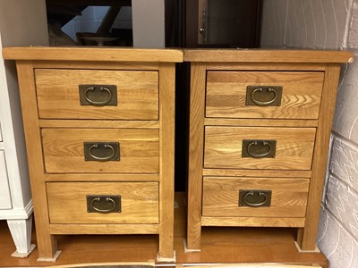 Lot 1324 - Pair of light oak three drawer bedside chests, 42cm wide, 35cm deep, 58.5cm high