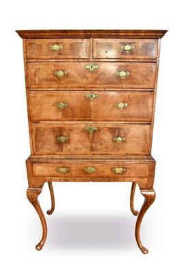 Lot 1118 - Early 18th century. walnut and crossbanded chest on stand