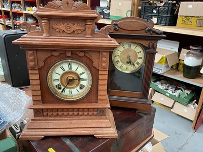 Lot 414 - Two early 20th century mantle clocks in carved wood cases (2).