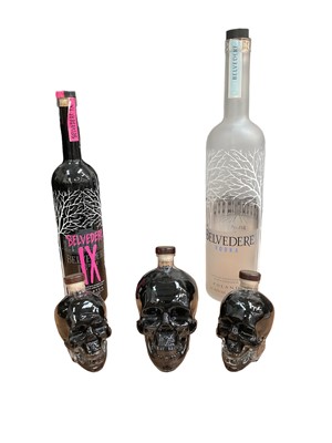 Lot 645 - Three empty bottles of Crystal Head vodka (filled with black water for decoration purposes) and two large empty Belvedere vodka bottles