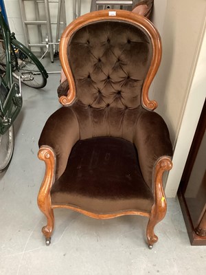 Lot 1370 - Victorian spoon back armchair with buttoned brown upholstery on cabriole front legs and castors