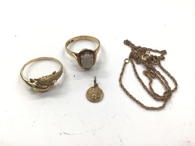 Lot 1064 - 14ct gold opal ring, 14ct gold double dolphin ring, 9ct gold miniature St. Christopher pendant and a gold (333) chain