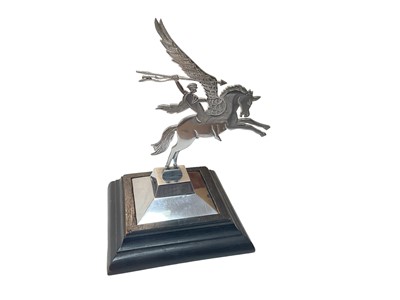 Lot 718 - Parachute Regiment Interest- Chromium plated Pegasus mascot, on faceted base with ebonised wood stand, 20cm in overall height.