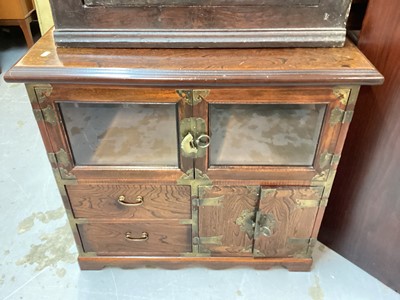 Lot 1401 - Oriental brass mounted cabinet with two glazed doors, two drawers and cupboards below, 77cm wide, 50cm deep, 69cm high