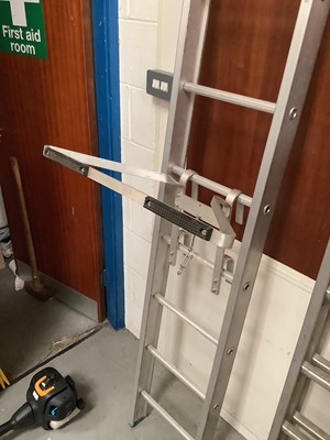 Lot 364 - Abru Starmaster DIY 2.5 meter ladder approximately extending too 4.47 meters together with a large industrial ladder and a ladder stand off. Ladder measuring approximately 4.5 meters
